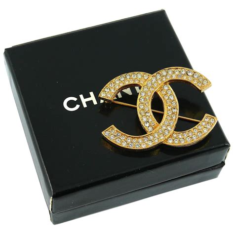 chanel charm ivory brooch|Chanel crystal brooches.